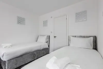 two beds sitting next to each other in a bedroom at RST Luxury Aparthotel in Liverpool