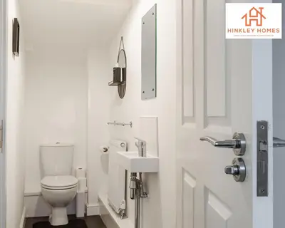 a bathroom with a toilet and a sink at Newbuild 4bed - City Centre - Free secure parking! By Hinkley Homes Short Lets & Serviced Accommodation in Liverpool