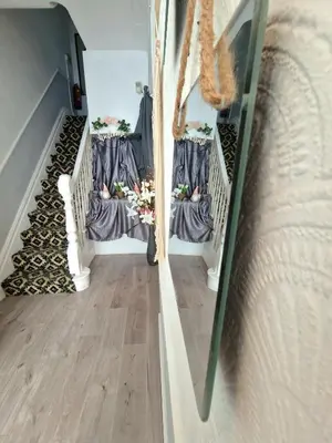 a hallway with three stairs with flowers on them at The Bosworth House Hotel in Blackpool