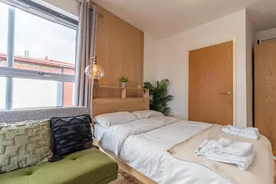 a bedroom with a bed and a window at Cosy Studio in Merseyside in Great Location in Liverpool