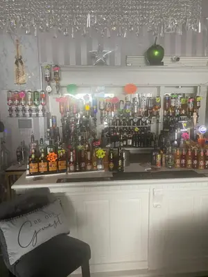 a bar with a lot of bottles of alcohol at The Cosy Nook in Blackpool