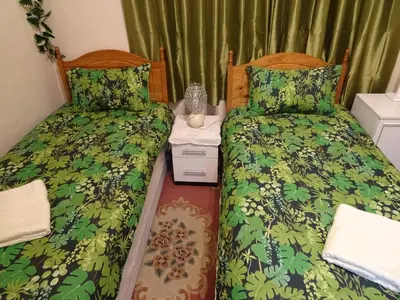 two beds sitting next to each other in a bedroom at CHARLES INN in Liverpool