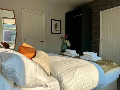 a bedroom with a large bed with pillows on it at Room 4 (8 Holland Street) in Liverpool