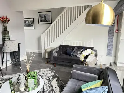 a living room with a couch and a table at Room 4 (8 Holland Street) in Liverpool
