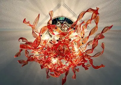 a large red chandelier hanging from a ceiling at 34 One in Lytham St Annes