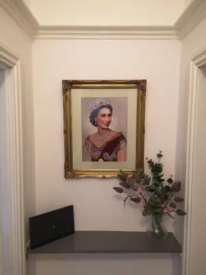 a framed picture of a woman on a wall at 34 One in Lytham St Annes