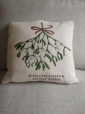 a pillow sitting on a bed with a sylvotide kisses michigan wishes at 34 One in Lytham St Annes