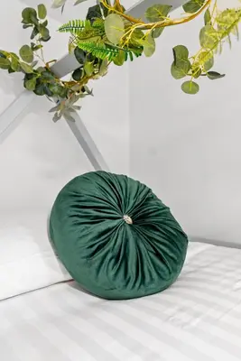 a green bowl sitting on a table next to a plant at The Treehouse at The Hideaway STAMP SA in Blackpool