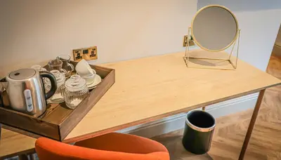 a dressing table with a mirror at Hope and Anchor in Flookburgh