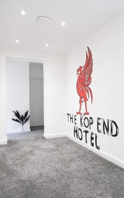 a room with a sign that reads the top end hotel at The Kop End Penthouse in Liverpool