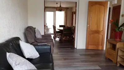 a living room with a couch and chairs and a table at Beeston House in Thornton