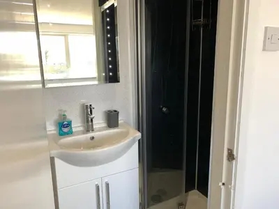a bathroom with a sink and a shower at Beach Front Apartment with Free Parking, St Annes in Lytham St Annes