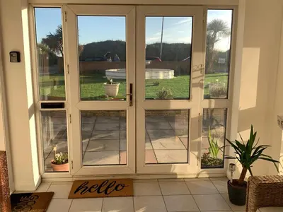 an open door with a view of a patio at Beach Front Apartment with Free Parking, St Annes in Lytham St Annes