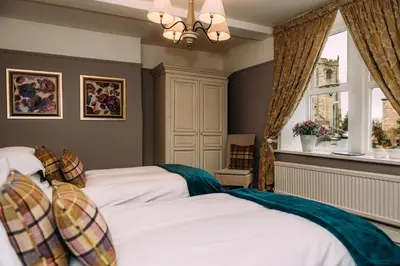 a bedroom with two beds and a window at The Waddington Arms in Waddington