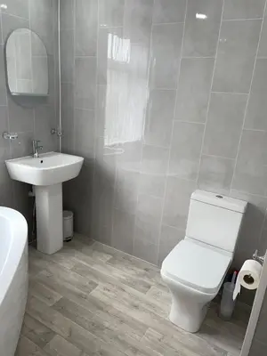 a bathroom with a white toilet and a sink at Croyden villa in Blackpool