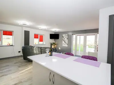 a living room with a white counter and a couch at The Annex in Ulverston