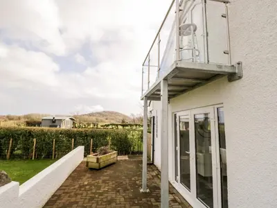 a balcony on the side of a white building at The Annex in Ulverston