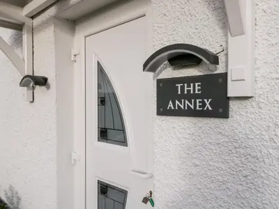 a sign that reads the amaze on the side of a building at The Annex in Ulverston