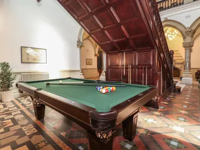 a pool table in a room with a ceiling at The Emma Suite Stone Cross Mansion in Ulverston