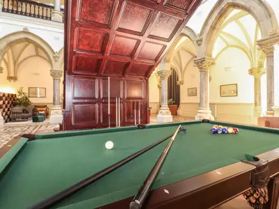 a pool table in a large room with afits at William Tower Suite Stone Cross Mansion in Ulverston