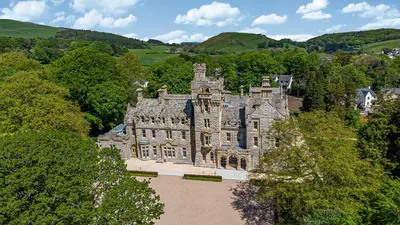 an old castle in the middle of a forest at The Lucy Suite Stone Cross Mansion in Ulverston