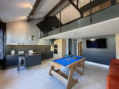 a living room with a pool table in it at The Luxury Penthouse by Sasco Apartments in Blackpool