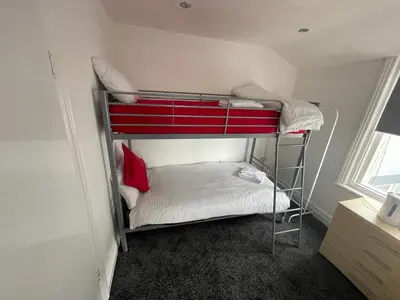 a couple of bunk beds in a room at PCK THAS HOTEL in Blackpool