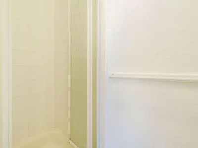 a shower with a glass door in a bathroom at Highbury in Blackpool