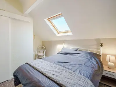 a bedroom with a bed and a skylight at Highbury in Blackpool