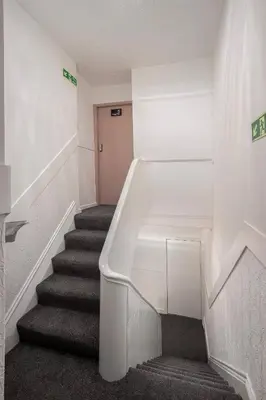 a staircase in a building with a stair case at Jellyfish Apartments in Blackpool