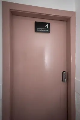 a close up of a door with a sign on it at Jellyfish Apartments in Blackpool