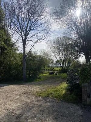 a park with trees and a dirt road at Heywood Glamping in Ormskirk