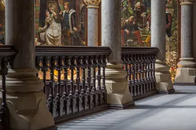 a hallway of a cathedral with paintings on the wall at The Arthur Suite Stone Cross Mansion in Ulverston
