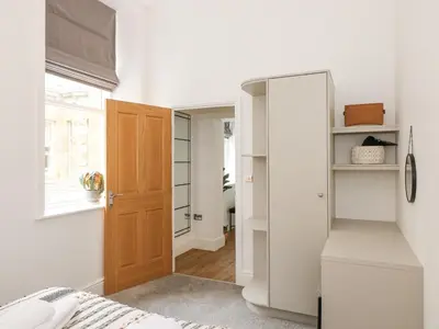 a bedroom with a closet and a door at The Elizabeth Suite Stone Cross Mansion in Ulverston