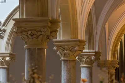 a row of columns in a church with an arched ceiling at The Elizabeth Suite Stone Cross Mansion in Ulverston