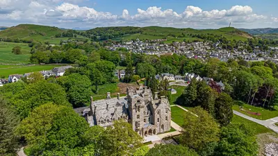 an aerial view of an old castle in a town at The Elizabeth Suite Stone Cross Mansion in Ulverston