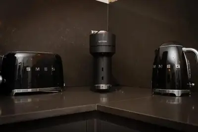 a counter with two coffins and a coffee maker on it at Capri Stays - Apartment One in Blackpool