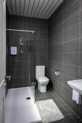 a bathroom with a shower and a toilet and a sink at Town View Apartment by Sasco in Blackpool