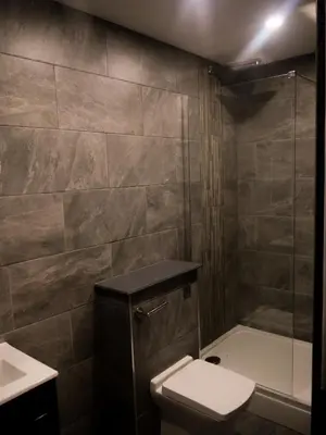 a bathroom with a shower and a toilet and a sink at New Oxford House Apartments By Happy Days in Liverpool
