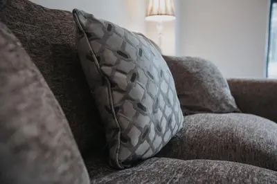 a pillow sitting on top of a couch at RST Cumberland Street in Liverpool