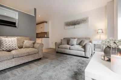 a living room with two couches and a table at RST Cumberland Street in Liverpool