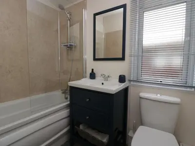 a bathroom with a sink and a toilet and a shower at Lakeland Dream South Lakeland Leisure Lodge in Carnforth