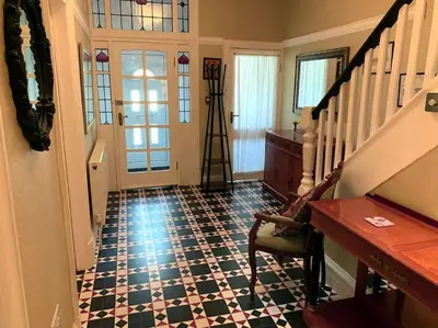 a room with a staircase and aoyer with a floor at Heather Glen. Six bedroom home near the sea. in Blackpool