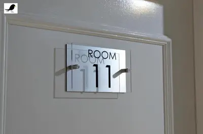 a white door with a room sign on it at Blackbird Accommodation and Luxury Apartments room 11 in Blackpool
