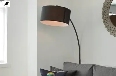 a floor lamp in a living room with a couch at Blackbird Accommodation and Luxury Apartments room 11 in Blackpool