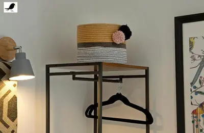 a straw hat on a stand next to a lamp at Blackbird Accommodation and Luxury Apartments room 14 in Blackpool