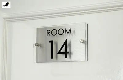 a clock on a door with room on it at Blackbird Accommodation and Luxury Apartments room 14 in Blackpool