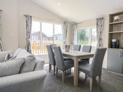 a dining room with a table and chairs at Parkers Place in Carnforth