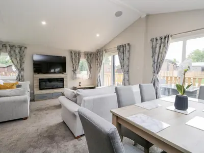 a living room with a couch and a table at Parkers Place in Carnforth