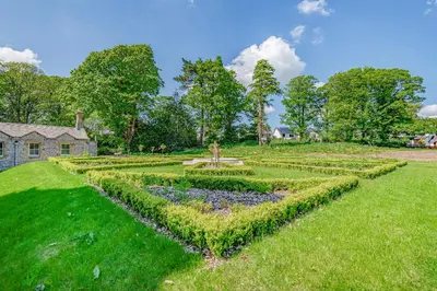 a garden in front of a house at Rowley House at Stone Cross Mansion in Ulverston